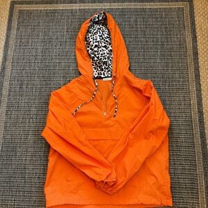 Vibrant Orange Windbreaker with Cheetah Accents